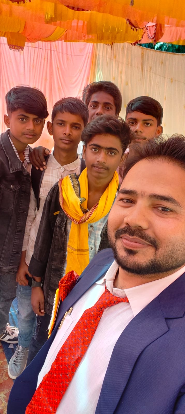 Director with students at school event